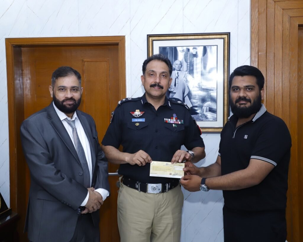 Sindh Police and Meezan Bank officials at the signing ceremony for a modern paddle court in Karachi