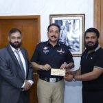 Sindh Police and Meezan Bank officials at the signing ceremony for a modern paddle court in Karachi