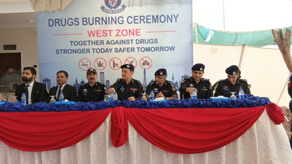 Karachi police officials attend a drug disposal ceremony in Surjani Town