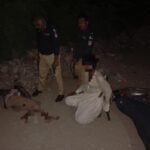 Police encounter in Karachi's Darakhshan area, with arrested suspects and recovered weapon