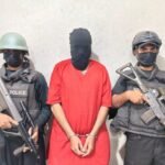 CTD Karachi officials arresting a suspected target killer during a joint security operation.