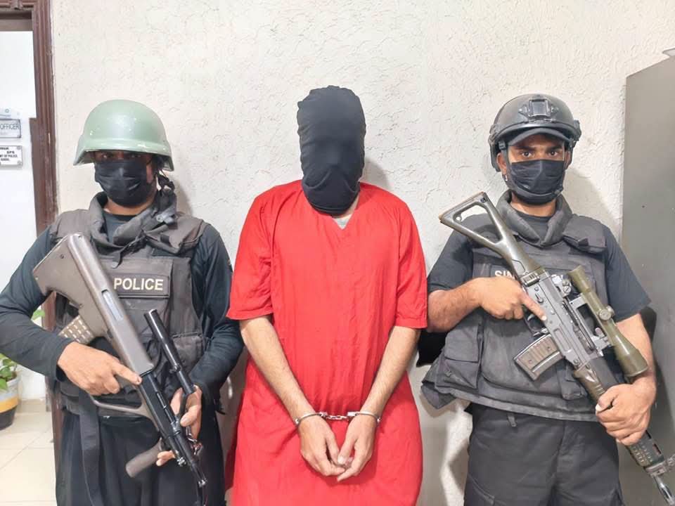 CTD Karachi officials arresting a suspected target killer during a joint security operation.