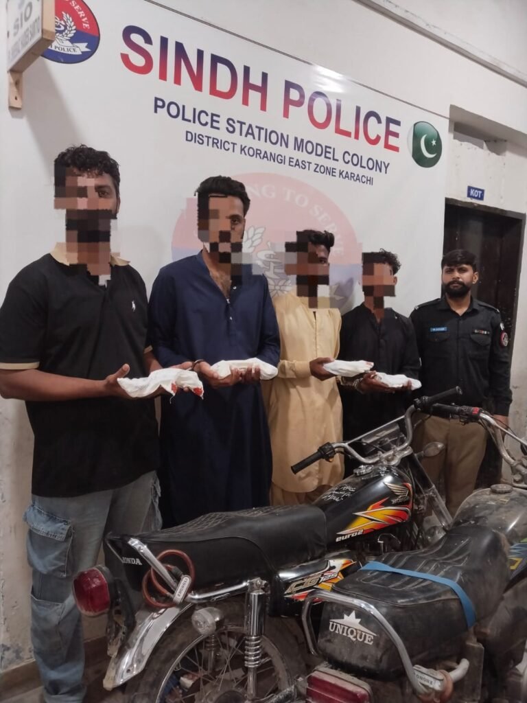 Karachi police officers with arrested motorcycle lifters and recovered stolen motorcycles and weapons