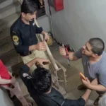 Police officers investigating a viral women’s fight incident in Defence Karachi