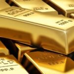 Gold bars and coins representing a sharp rise in gold prices in global and Pakistani markets