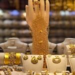 Gold bars and coins representing a sharp decline in gold prices