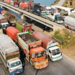 Goods trucks on a highway amid concerns over rising diesel prices