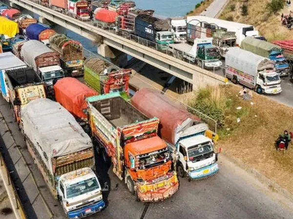 Goods trucks on a highway amid concerns over rising diesel prices