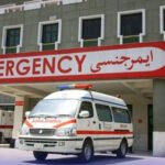 Injured schoolgirls receiving medical assistance after ceiling plaster fell at a government school in Sukkur.