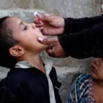Children receive polio booster doses during a vaccination campaign at a school in Naushahro Feroze