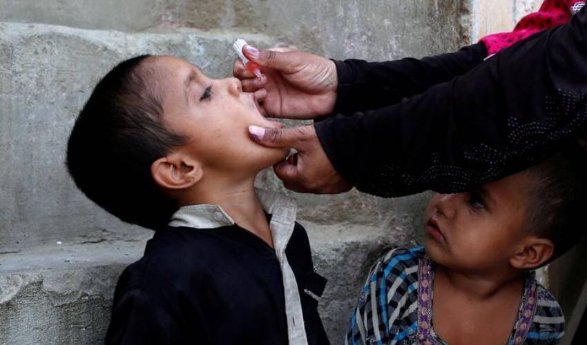 Children receive polio booster doses during a vaccination campaign at a school in Naushahro Feroze