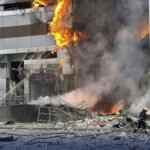 Rescue workers at the site of a Russian drone attack near Kyiv