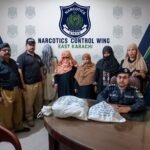 Narcotics officials display recovered ice during a drug crackdown in Karachi.