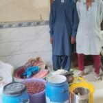 Karachi police officials recover gutka and mawa-making materials during a raid in Landhi