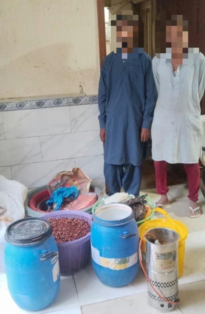 Karachi police officials recover gutka and mawa-making materials during a raid in Landhi