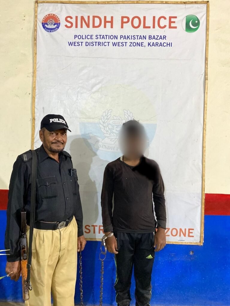 Pakistan Bazaar Police officers after arresting a wanted street criminal in Karachi