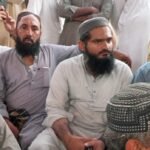Sardar Muhammad Farooq Gujjar meeting the father of Hafiz Rosham after the Manghopir robbery incident.