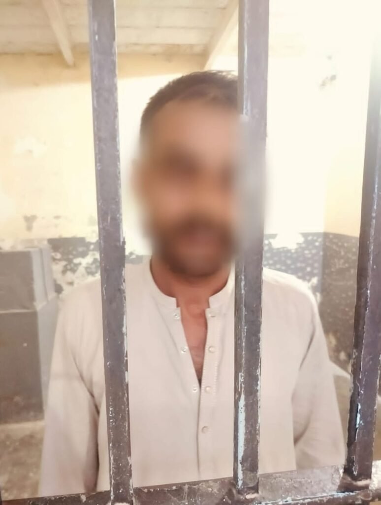 East Police officials arrest a suspected street crime suspect in Karachi
