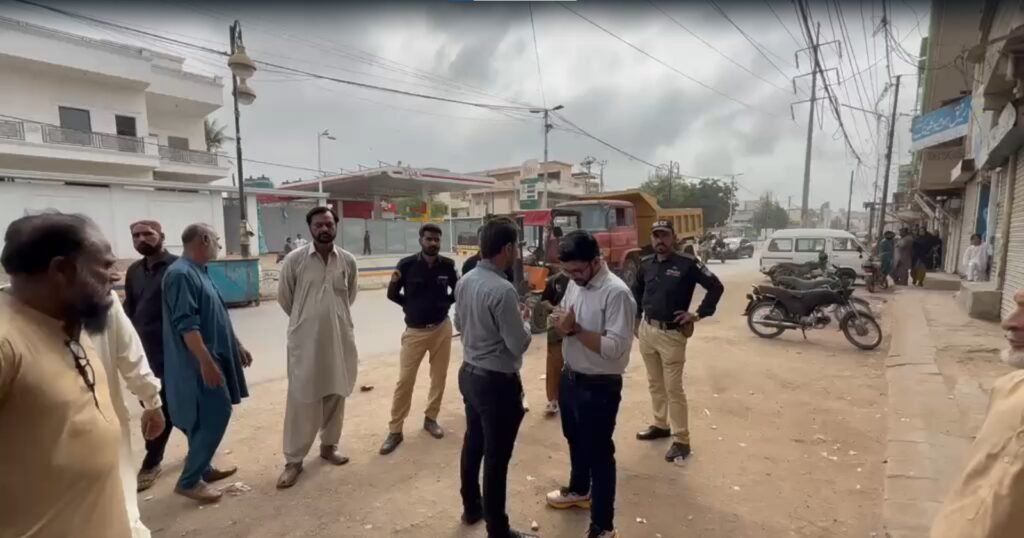 Karachi municipal authorities removing illegal stalls and encroachments during an operation in Karimabad.