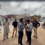 Karachi municipal authorities removing illegal stalls and encroachments during an operation in Karimabad.
