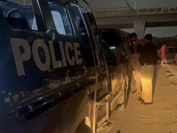 Police investigation at the house where a mother and three children were killed in Surjani Town