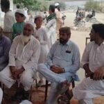 Protesters gather outside Manghopir Police Station demanding arrests in Rosham Khan murder case.