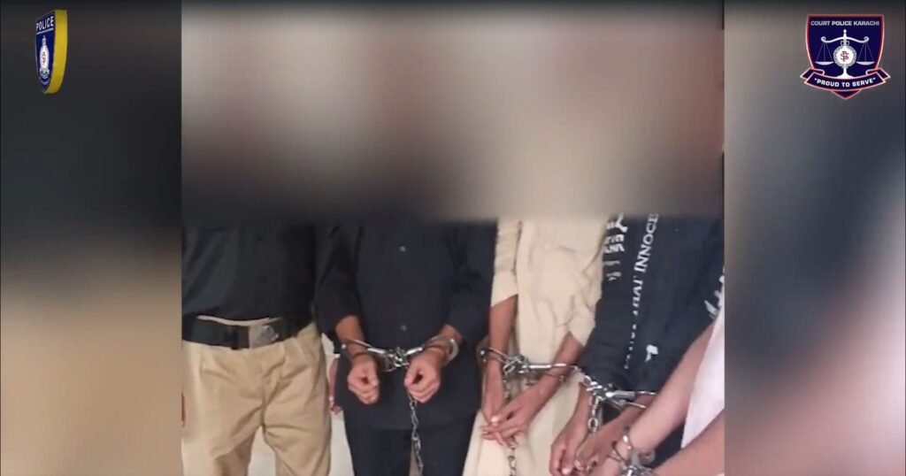 Women prisoners wearing special identification vests during court security arrangements