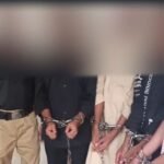 Women prisoners wearing special identification vests during court security arrangements