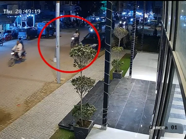 CCTV footage of motorcycle-riding suspects outside a builder's booking office in Paposh Nagar, Karachi.