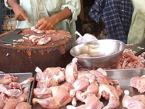 Fresh chicken meat displayed for sale at a poultry shop in Karachi