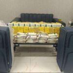 Customs officials seize suspected illegal medicines from a passenger arriving at Karachi Airport.