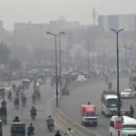 Heavy traffic on a Pakistani road contributing to urban air pollution and vehicle emissions.