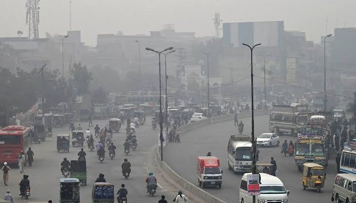 Heavy traffic on a Pakistani road contributing to urban air pollution and vehicle emissions.