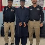 Docks Police arresting a suspected street criminal during a search operation in Sultanabad Karachi
