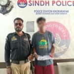 Khoka Par police arresting a suspected street criminal with illegal weapon in Karachi