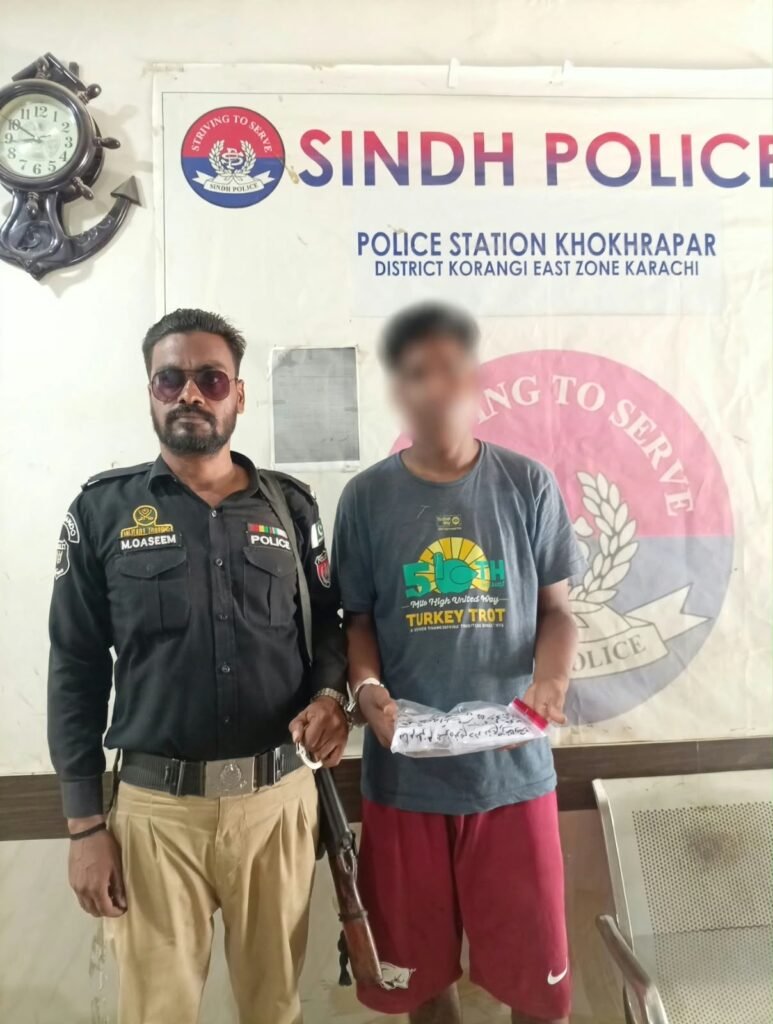 Khoka Par police arresting a suspected street criminal with illegal weapon in Karachi