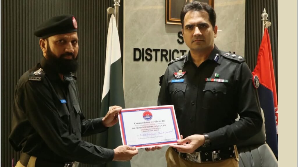 SSP Central Dr Muhammad Imran Khan awarding Shaheen Force personnel in Karachi