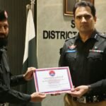 SSP Central Dr Muhammad Imran Khan awarding Shaheen Force personnel in Karachi