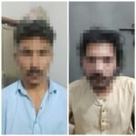 Karachi police arresting two suspects in an alleged gambling case in Shah Faisal Colony