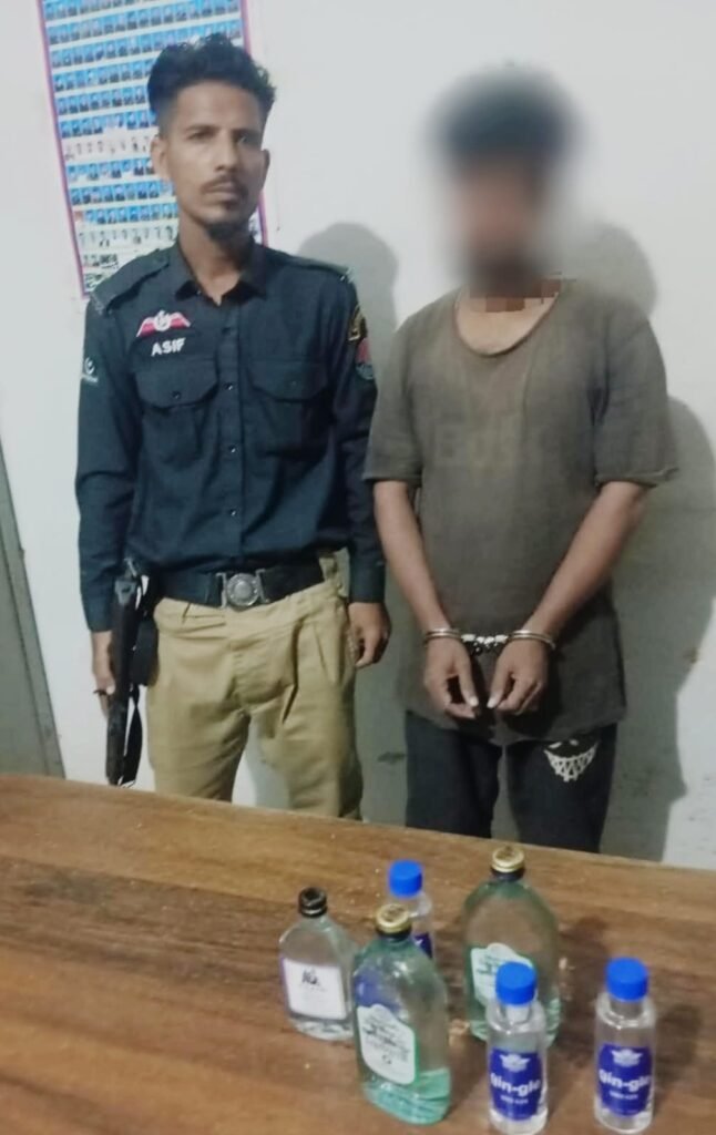 Karachi Brigade Police action against suspected liquor seller near Tauheed Chowk