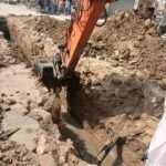 Karachi Water Corporation workers replacing a damaged 36-inch sewerage line in Model Zone, Korangi