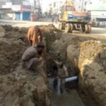 Repair work on a damaged 36-inch sewerage line in Model Zone, Korangi, Karachi
