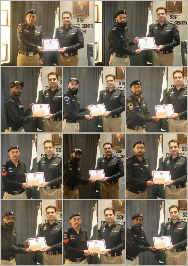 District Central Police officers in Karachi receive certificates and cash rewards for their work against street criminals.