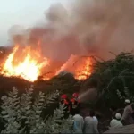 Rescue 1122 teams responding to bamboo fire near Chakr Hotel Karachi