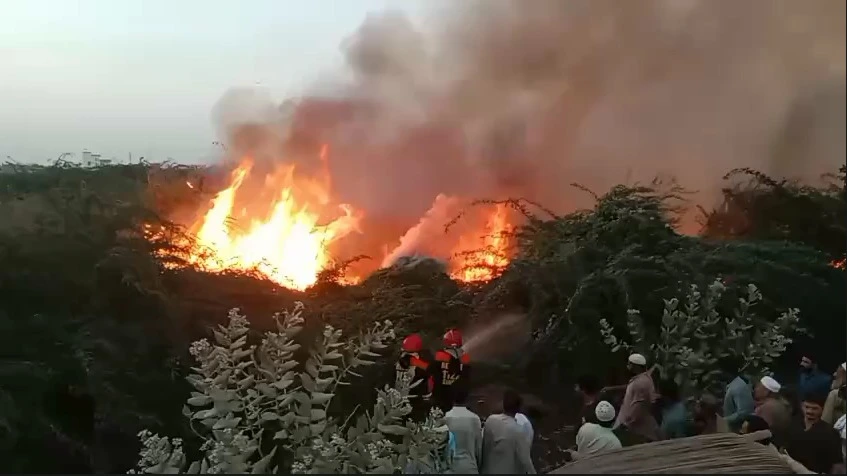 Rescue 1122 teams responding to bamboo fire near Chakr Hotel Karachi