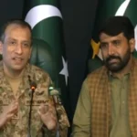 DG ISPR Ahmed Sharif Chaudhry presenting Muhammad Asif during a press conference in Islamabad