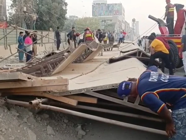 Rescue teams at the site of an under-construction bridge collapse in Gulshan Iqbal Karachi